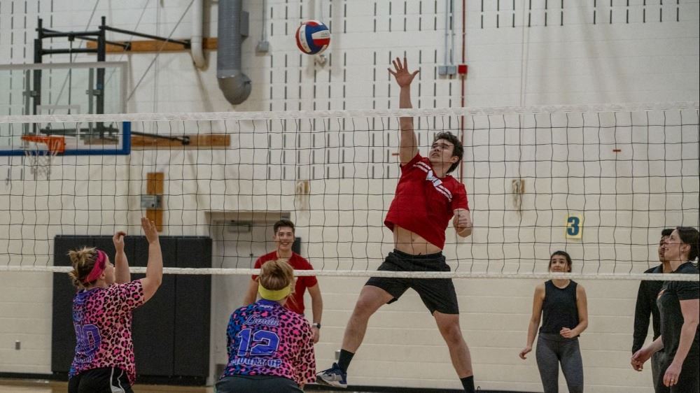People playing indoor volleyball