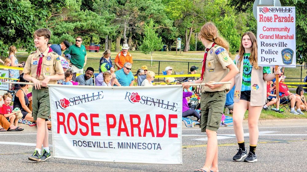 Rosefest Rose Parade - Boy Scouts carrying title banner